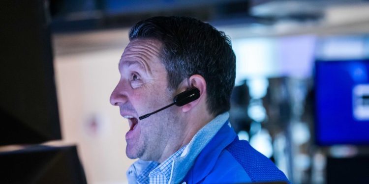 Dow rallies more than 500 points to record, closes above 37,000 for the first time