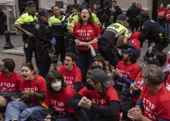 Protesters stage sit-in outside New York Stock Exchange to spotlight Gaza attacks